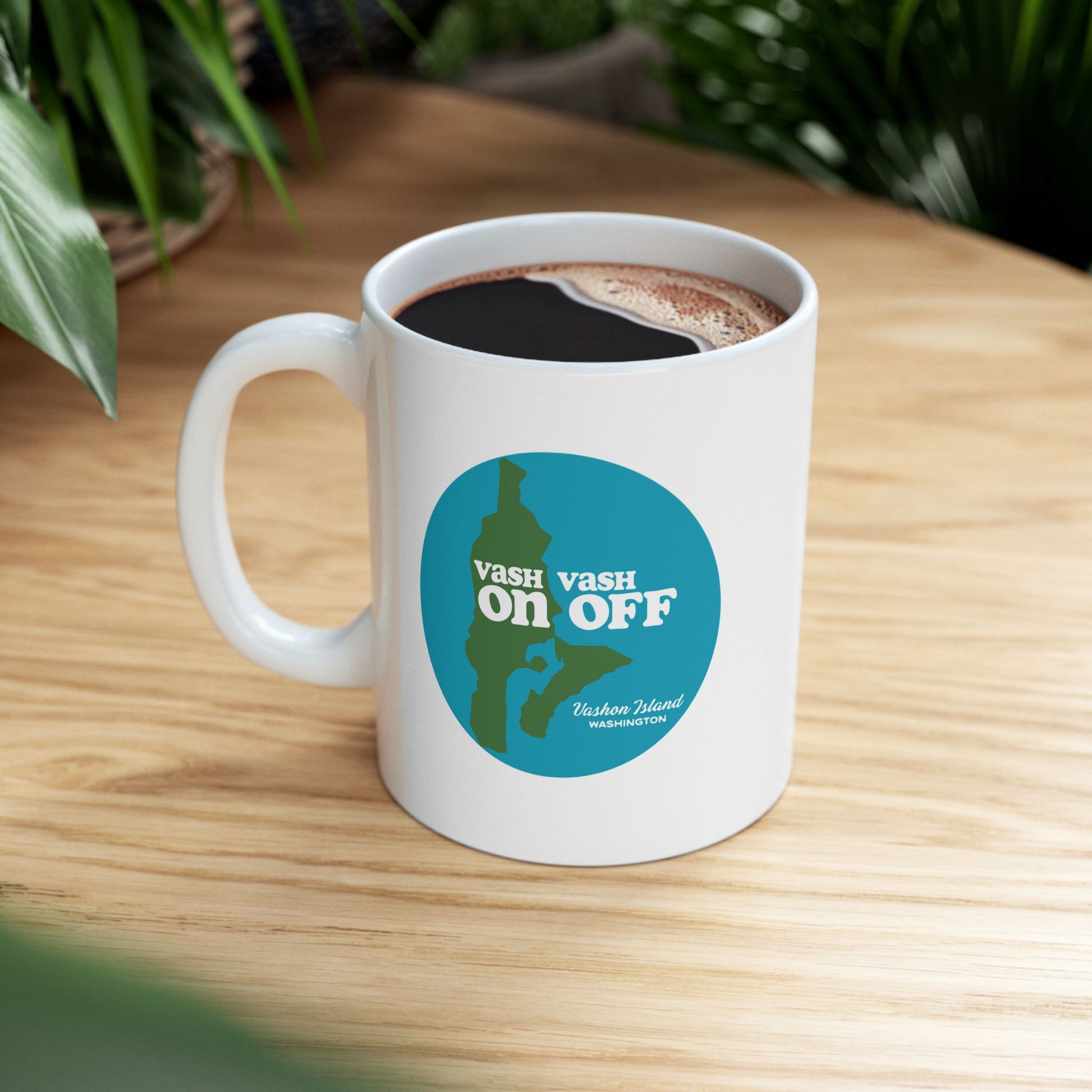 A white ceramic mug with blue and green Vashon Island, Washington design from Localintrigue.com